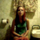 A girl films herself taking a shit on the toilet. The audio in this clip is not very good, so it is difficult to hear the pooping sounds or determine what she is saying.